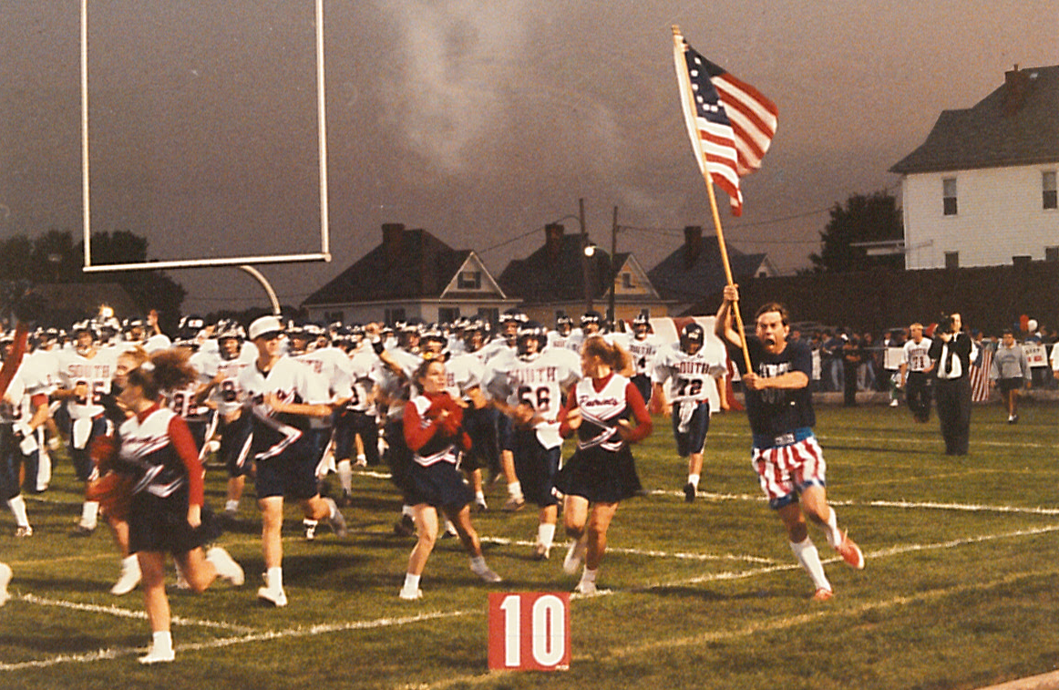 Larry "Mad Max" Maxwell helps bring the PSHS football team on the field during a 1994 game.