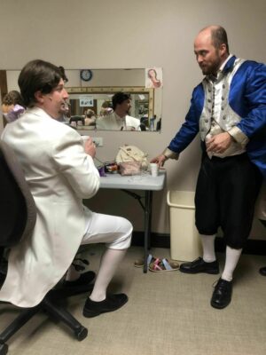 Actors preparing for the performance.